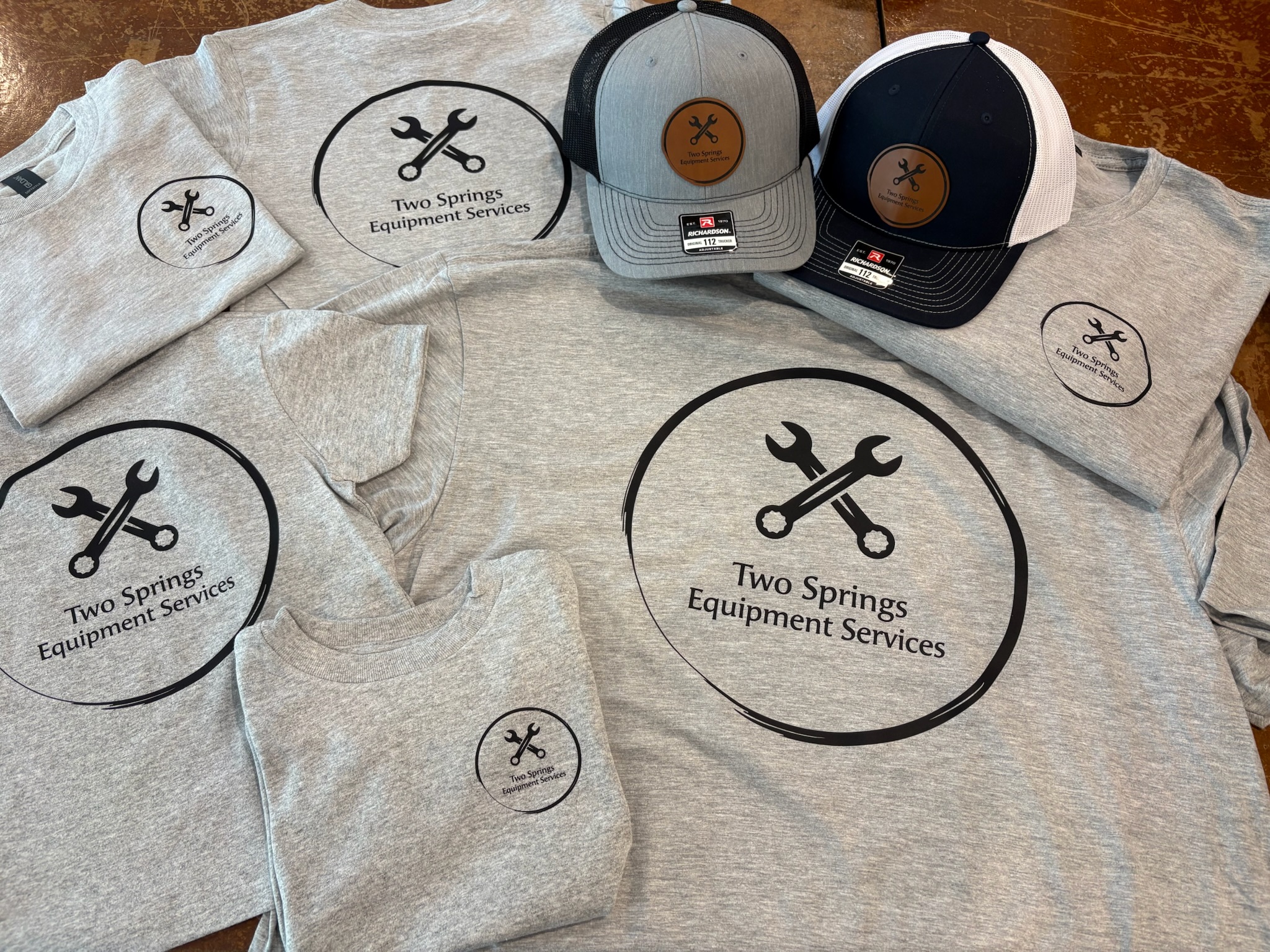 Two Springs Equipment Services shirts and hats